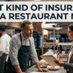 A restaurateur discusses policy options in a busy commercial kitchen; featured image for "What Kind of Insurance Does a Restaurant Need?" blog.